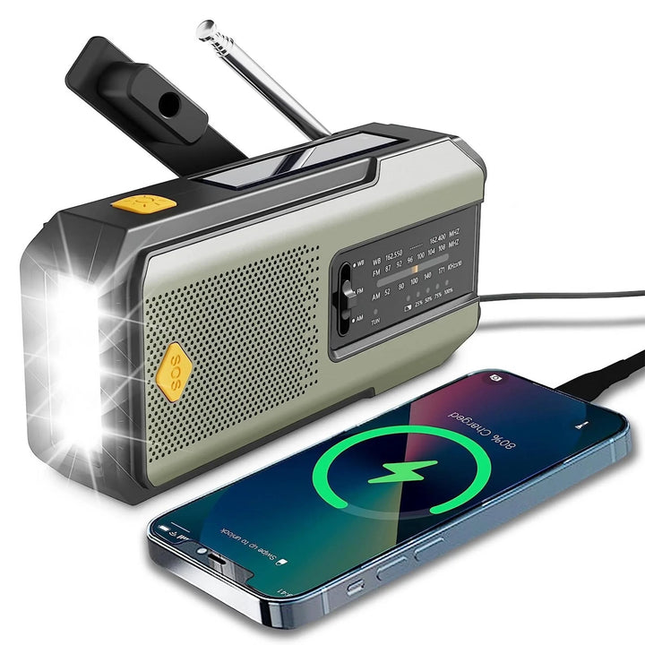Portable radio with flashlight and phone charging cable, on a white background
