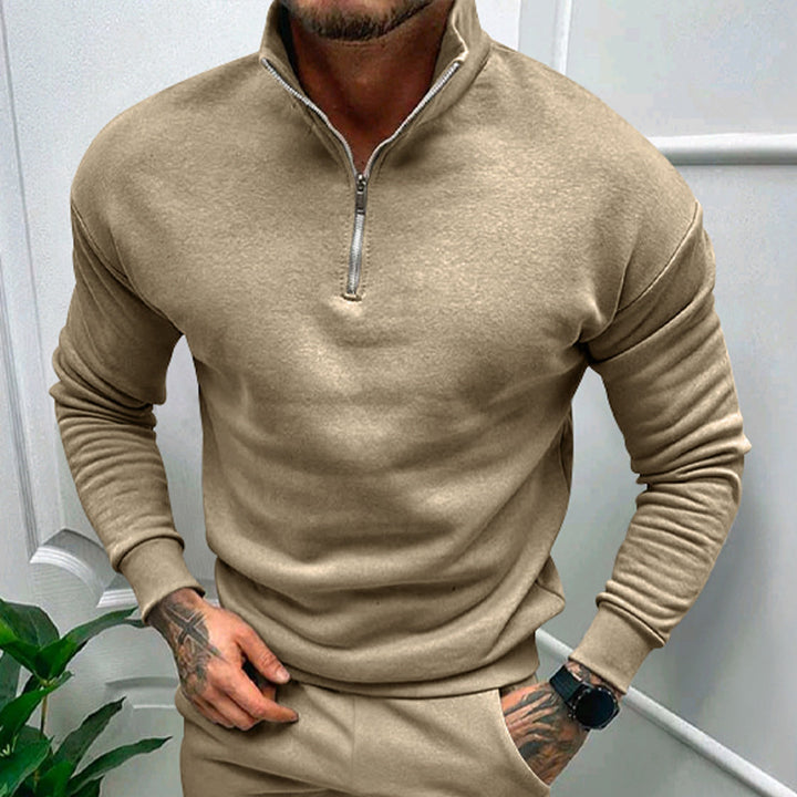Chic beige quarter-zip pullover with ribbed sleeves, designed for a sophisticated and versatile look.