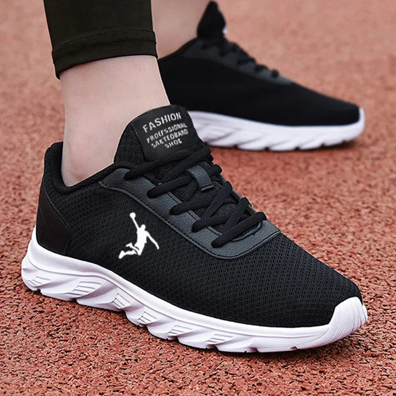 A stylish pair of black breathable mesh sneakers with a white sole, designed for walking and running.