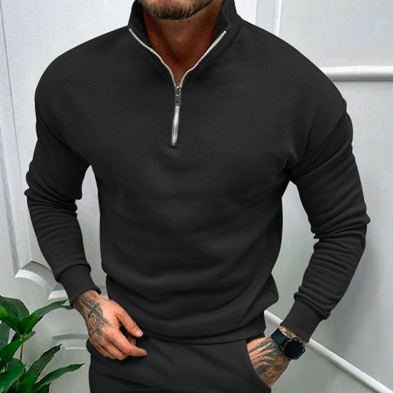 Sleek black quarter-zip pullover with a tailored fit, offering a perfect blend of style and comfort for casual or formal occasions.