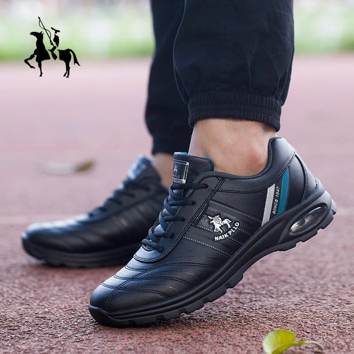 Black sneakers worn outdoors, featuring a breathable design and stylish finish.