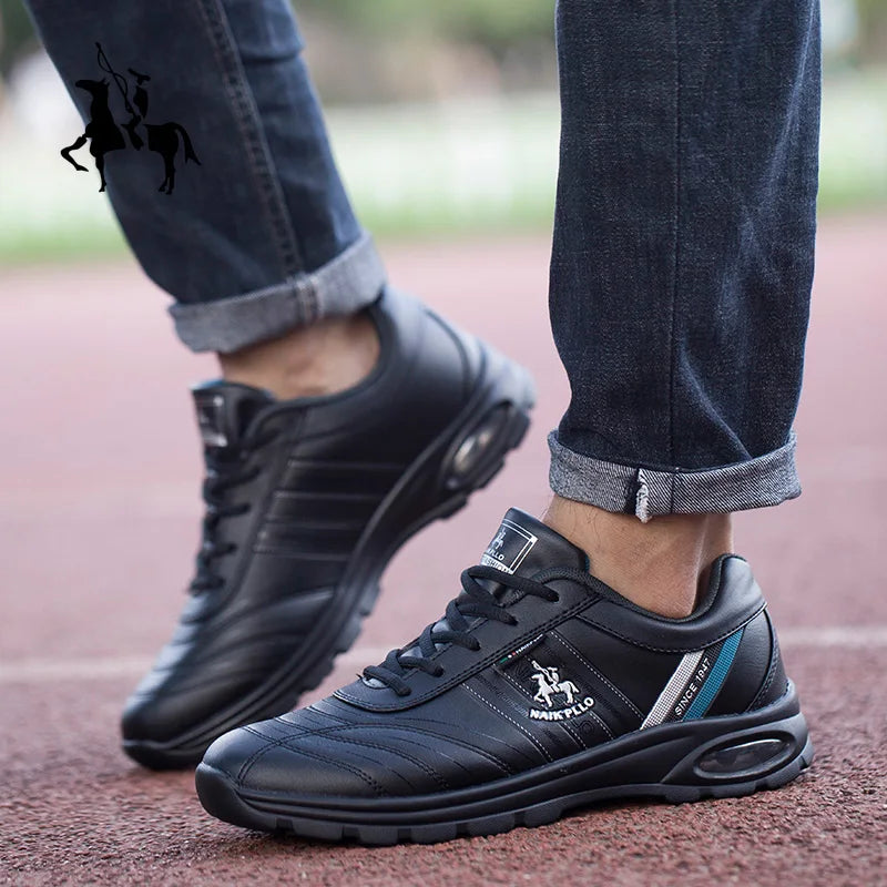 A pair of black sneakers with textured soles placed on a sidewalk for a street-style look.
