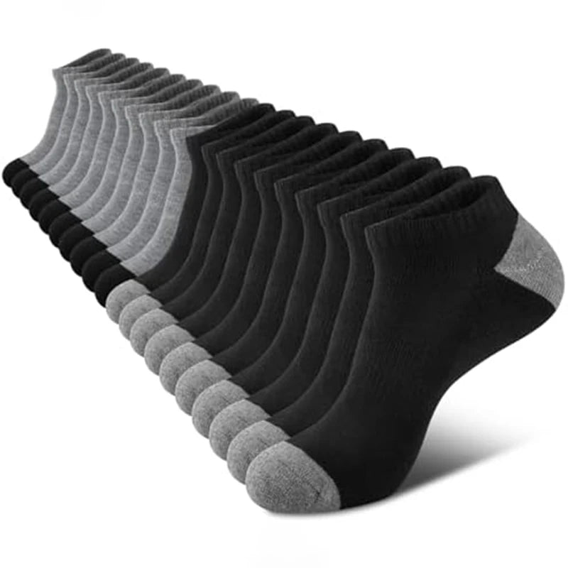 A stack of black cushioned sports socks arranged neatly in a row.