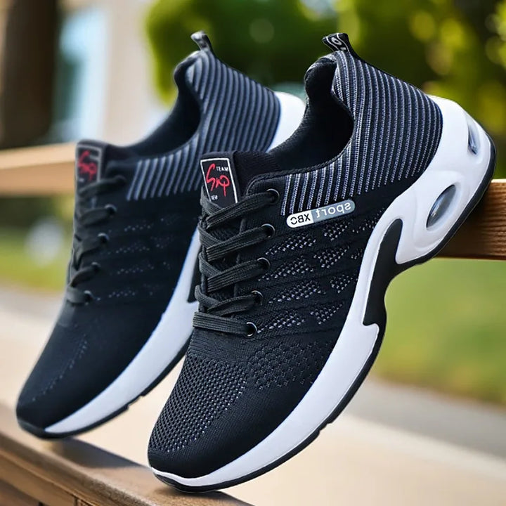 Sleek black and blue men’s running sneakers with breathable mesh upper.
