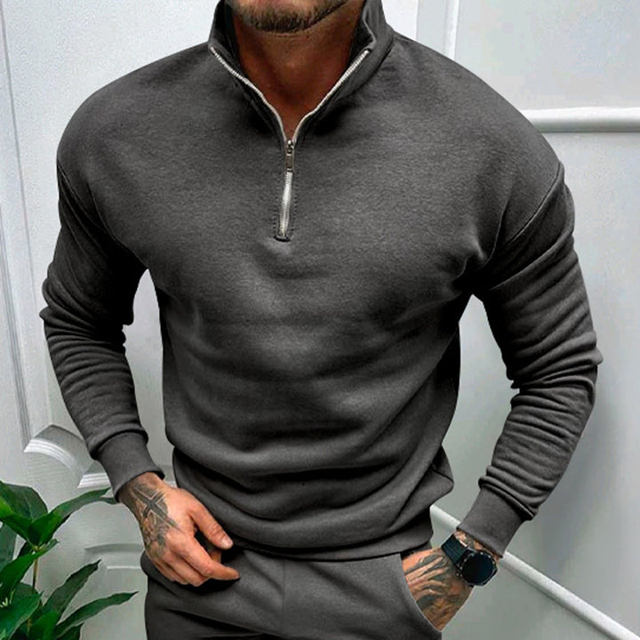 Modern charcoal gray quarter-zip pullover with a slim fit, designed for both comfort and sophistication.