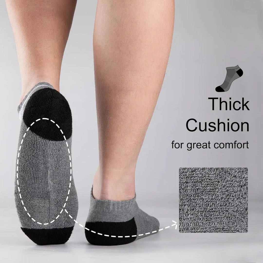 Close-up of grey socks highlighting thick cushioned sole for maximum comfort.