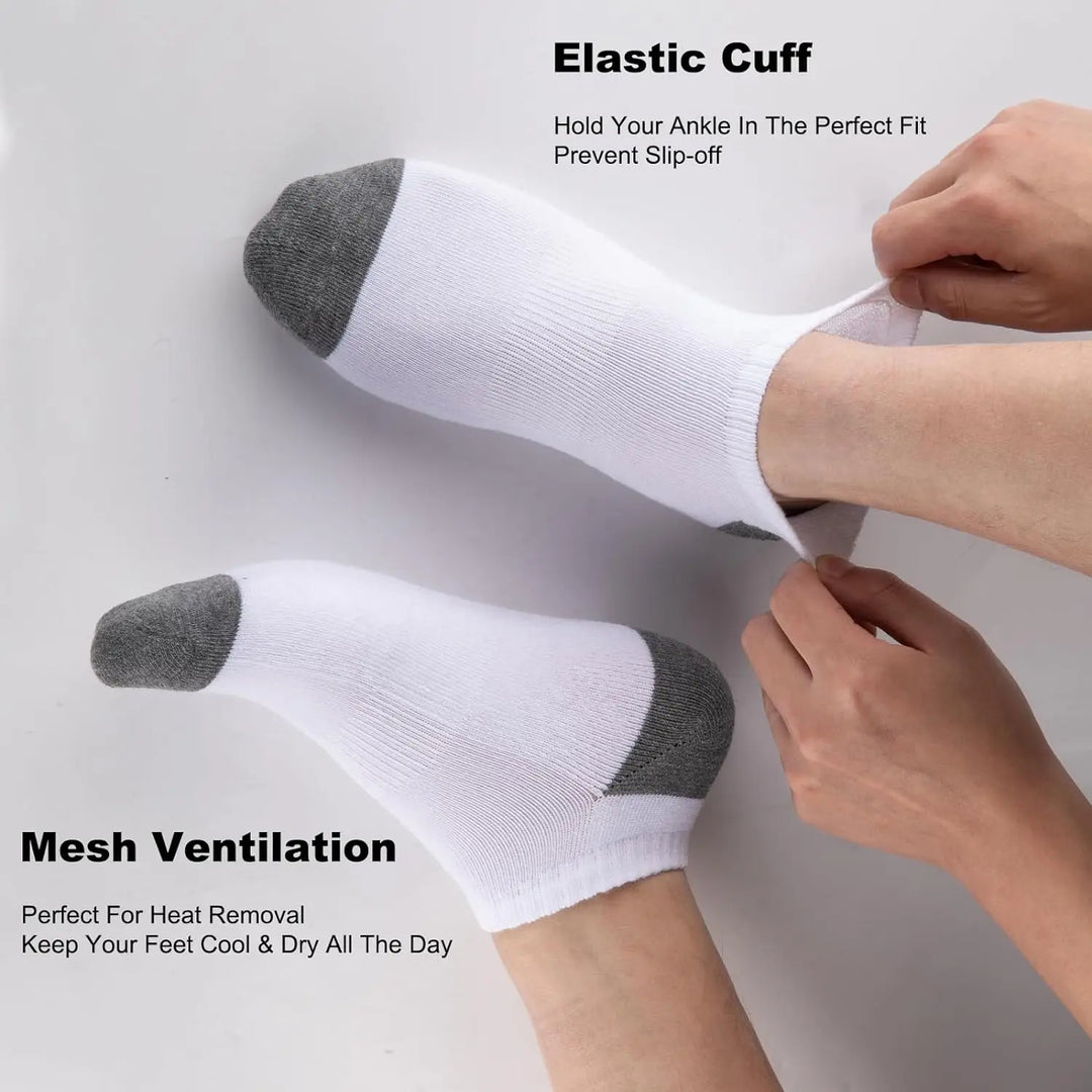 Close-up of white socks highlighting elastic cuff and breathable mesh.