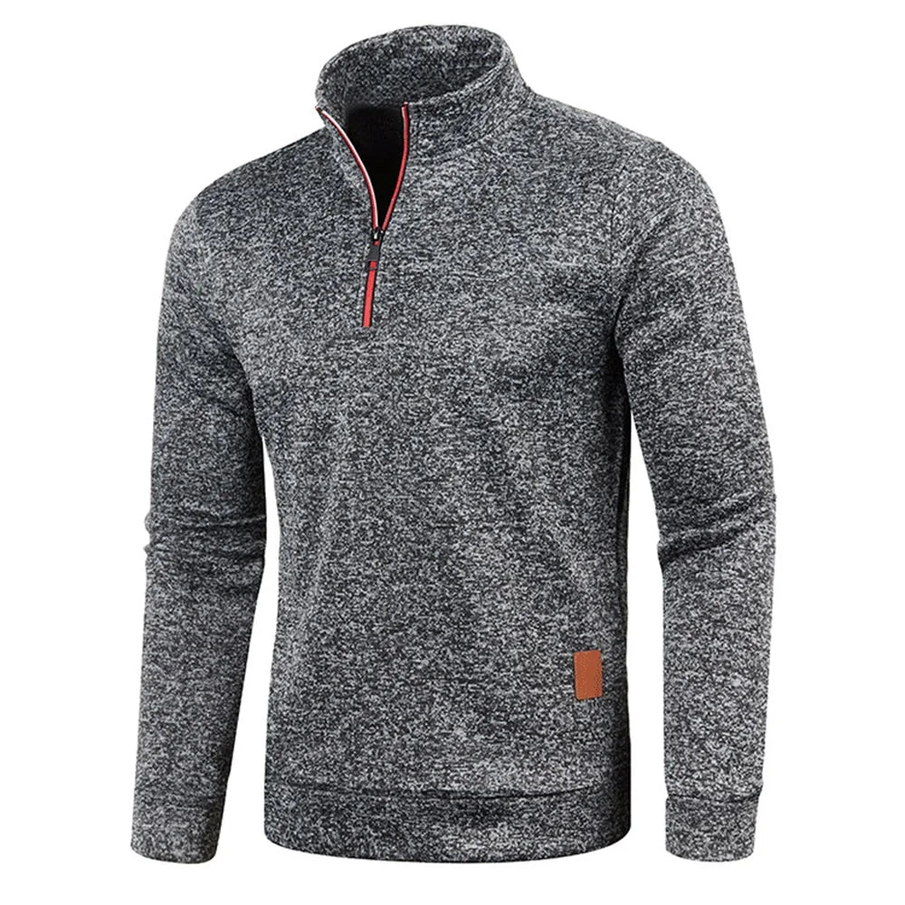A close-up of the gray quarter-zip pullover highlighting its warm fabric.