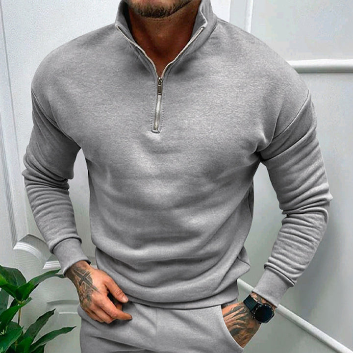 Classic gray quarter-zip pullover featuring a minimalist design for timeless appeal and versatility.