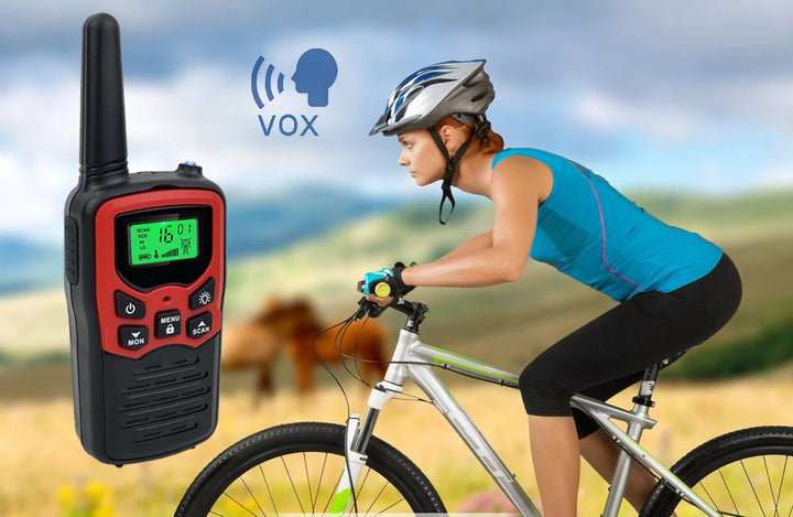 Woman riding a bike with a walkie-talkie and 'VOX' symbol in the background