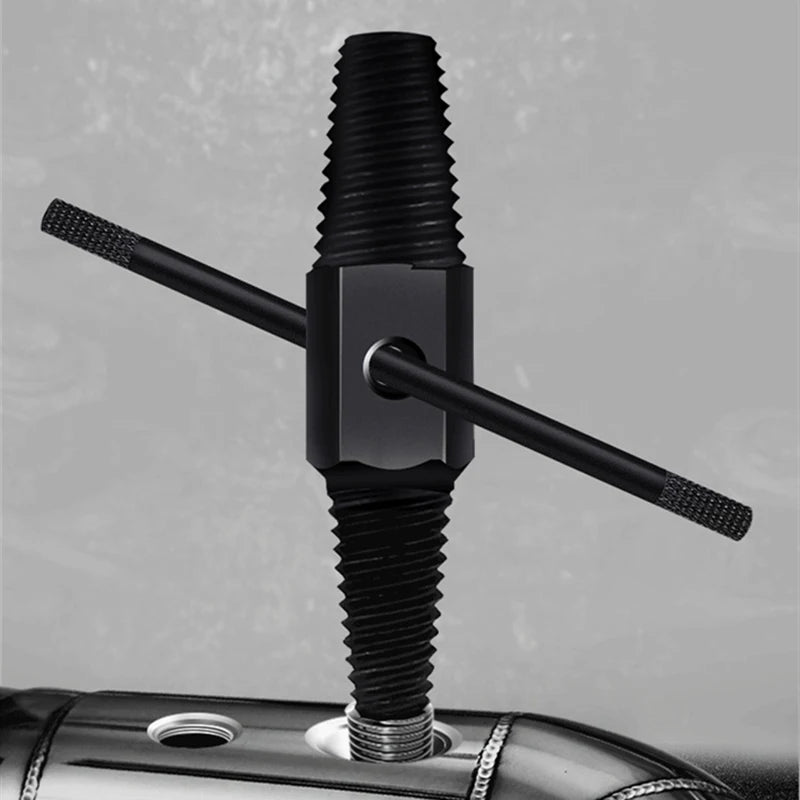 Black metal tool with threaded design on a gray background