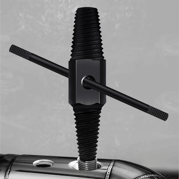 Black metal tool with threaded design on a gray background