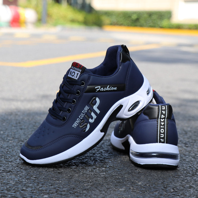 Side view of men's waterproof sneakers showing the non-slip rubber sole and thick cushioning.