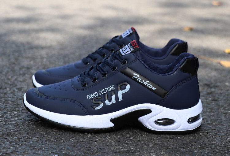 A trendy pair of running shoes displayed outdoors, perfect for urban streetwear fashion.

