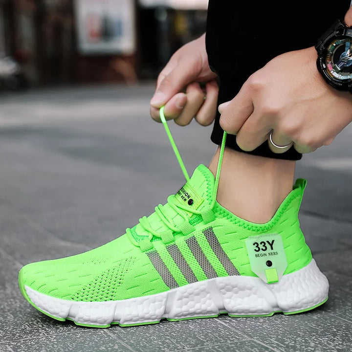 Vibrant neon green breathable mesh sneakers with a modern, lightweight design.