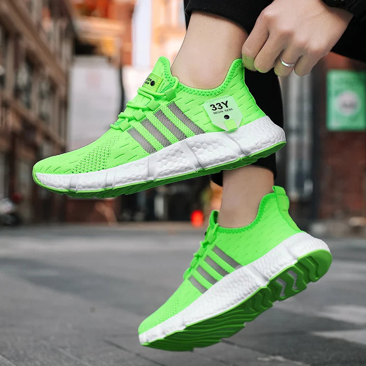 A person wearing neon green mesh sneakers, showcasing their bold color and comfortable fit.