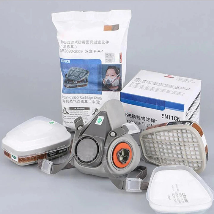 17-in-1 6200 Gas Mask Respirator mask with filters and packaging on a gray background