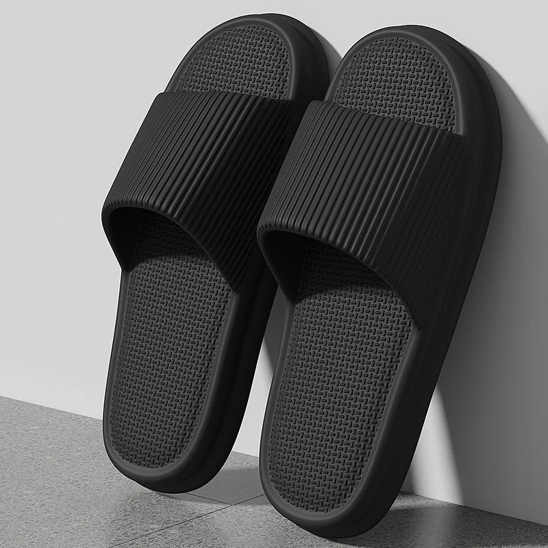Black slippers on a light gray background