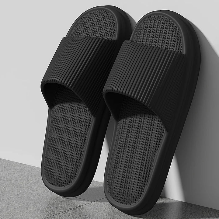 Black slippers on a light gray background