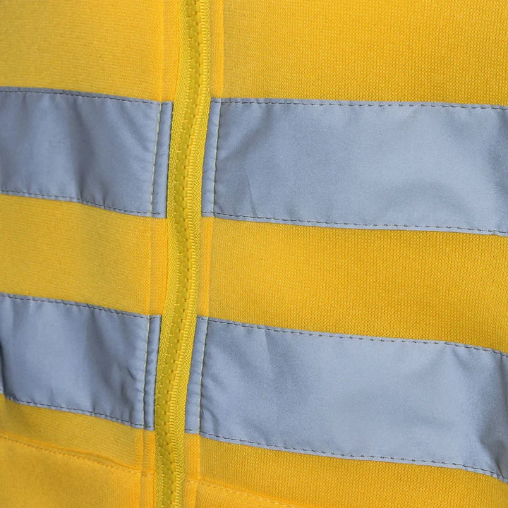 Close-up of a yellow and gray striped fabric with a zipper.