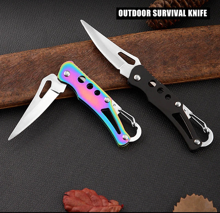 Two outdoor survival knives on a dark surface with a wooden background.