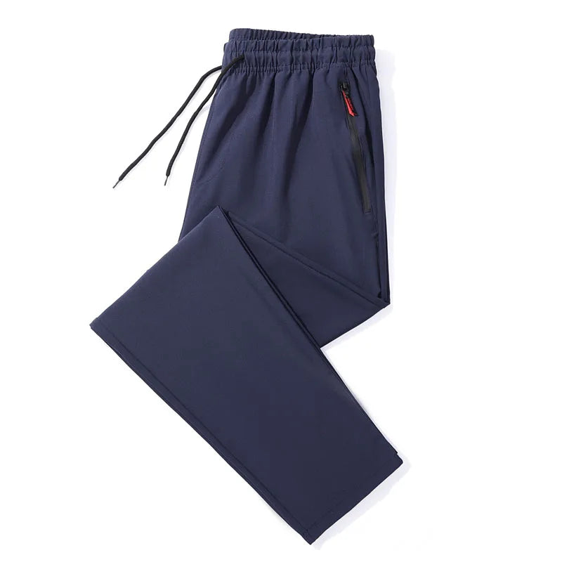 Navy blue pants with a drawstring on a white background