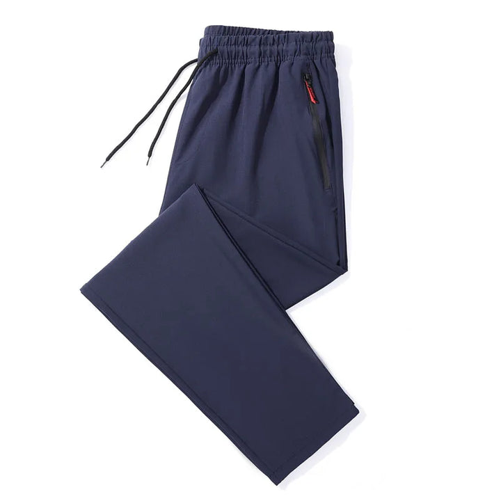 Navy blue pants with a drawstring on a white background