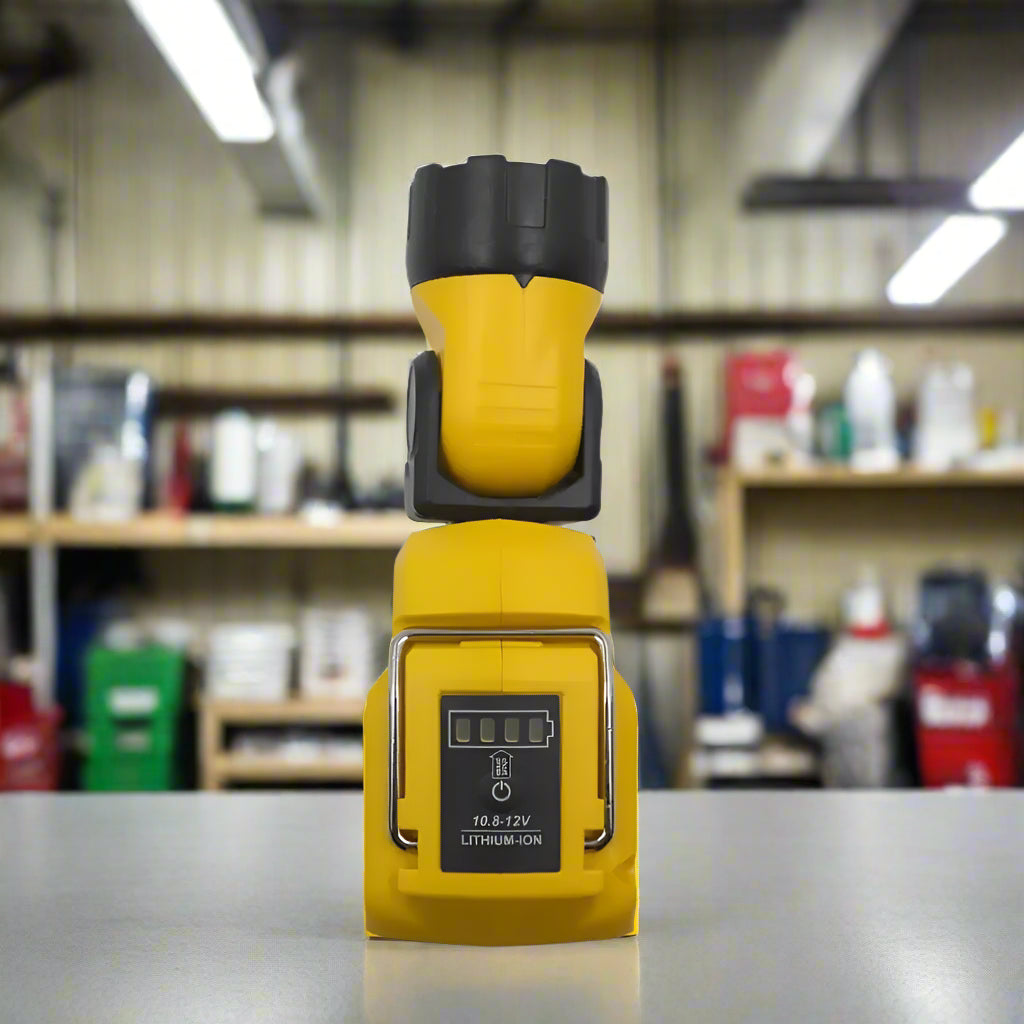 Angled front view showing LED light on a steel tool cabinet in a commercial auto repair shop