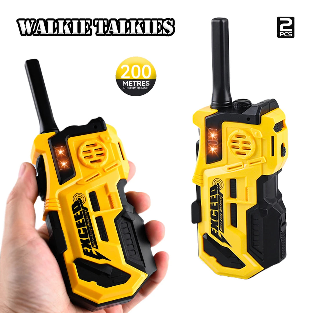 Two yellow and black Exceed walkie talkies with a hand holding one, on a white background.