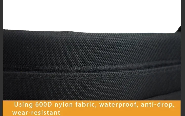 Close-up of black fabric with text about 600D nylon properties.