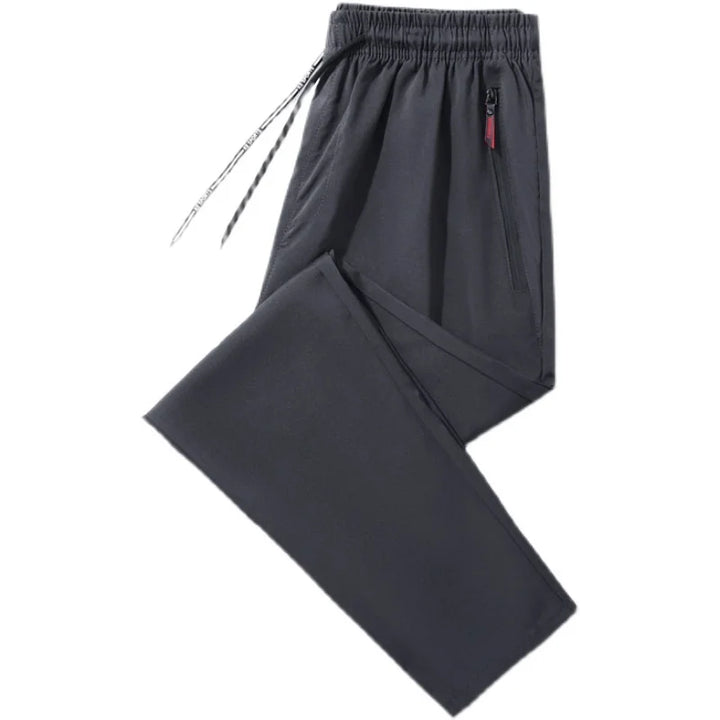 Dark gray pants with a red tag on a white background