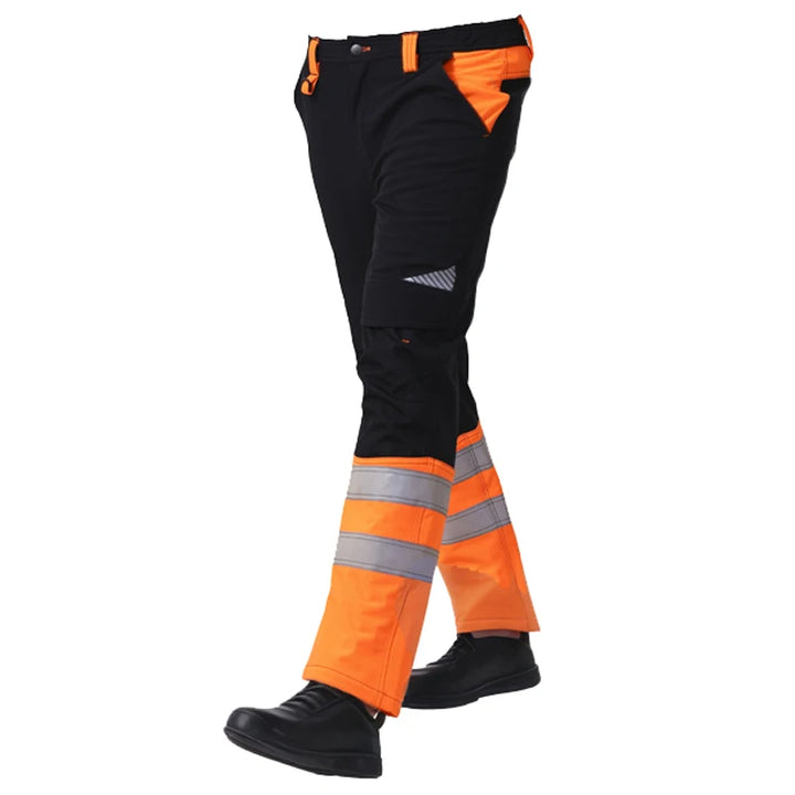Black and orange work pants with reflective stripes on a white background