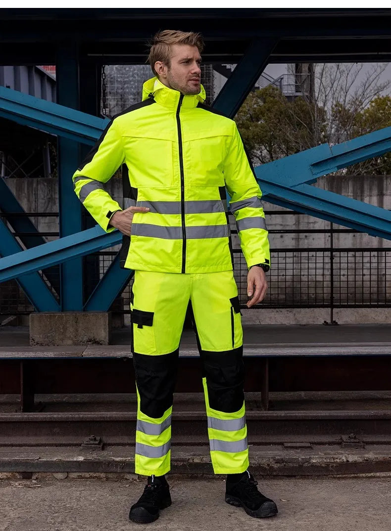 Person wearing a high-visibility safety suit with reflective stripes outdoors.