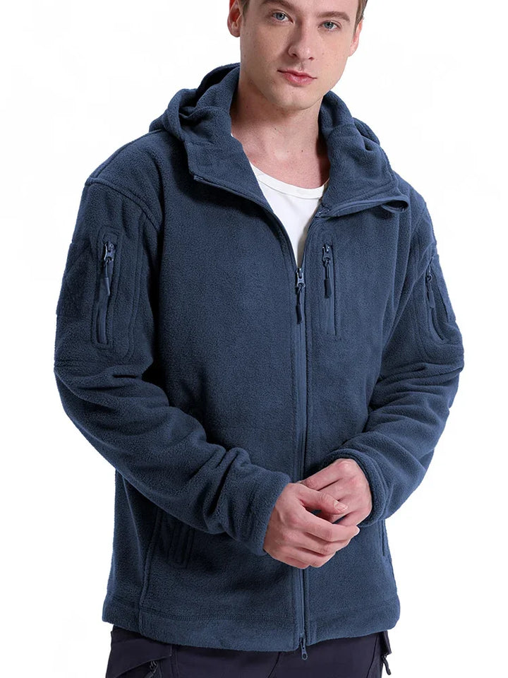 Man wearing a blue fleece jacket on a white background