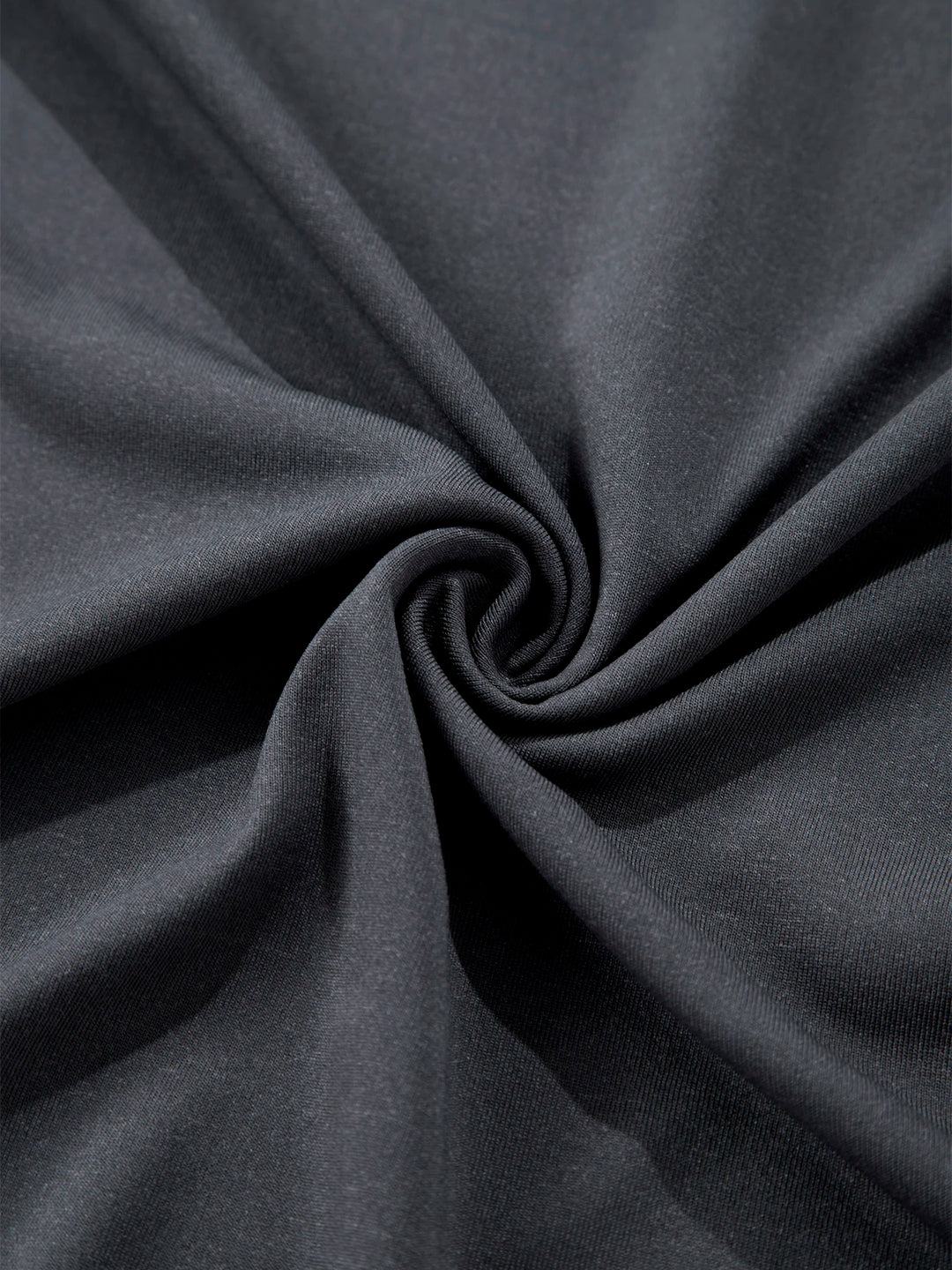 Close-up of dark gray fabric with folds