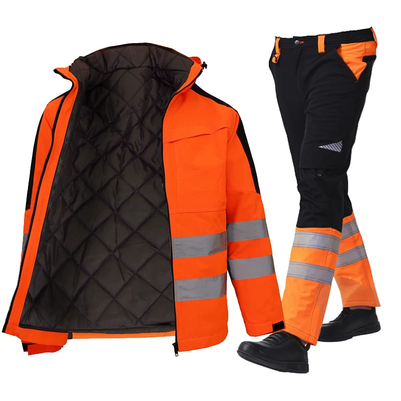 Orange and black safety jacket and pants with reflective stripes on a white background