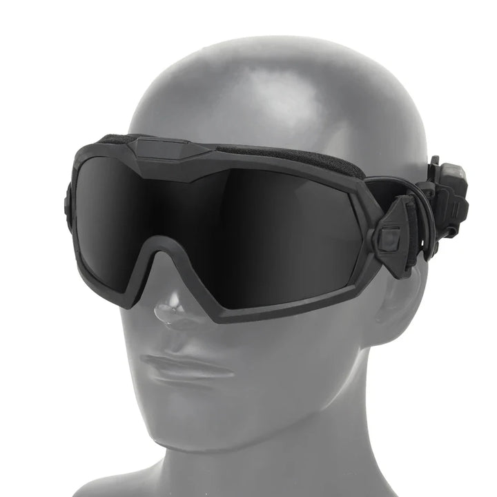 Black goggles on a mannequin head against a white background