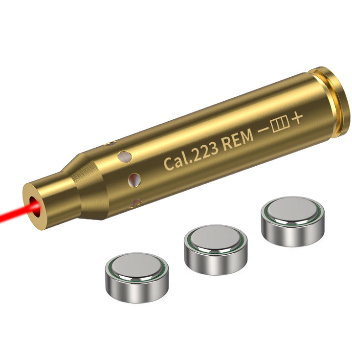 Gold laser pointer with 'Cal.223 REM' marking and three batteries on a white background