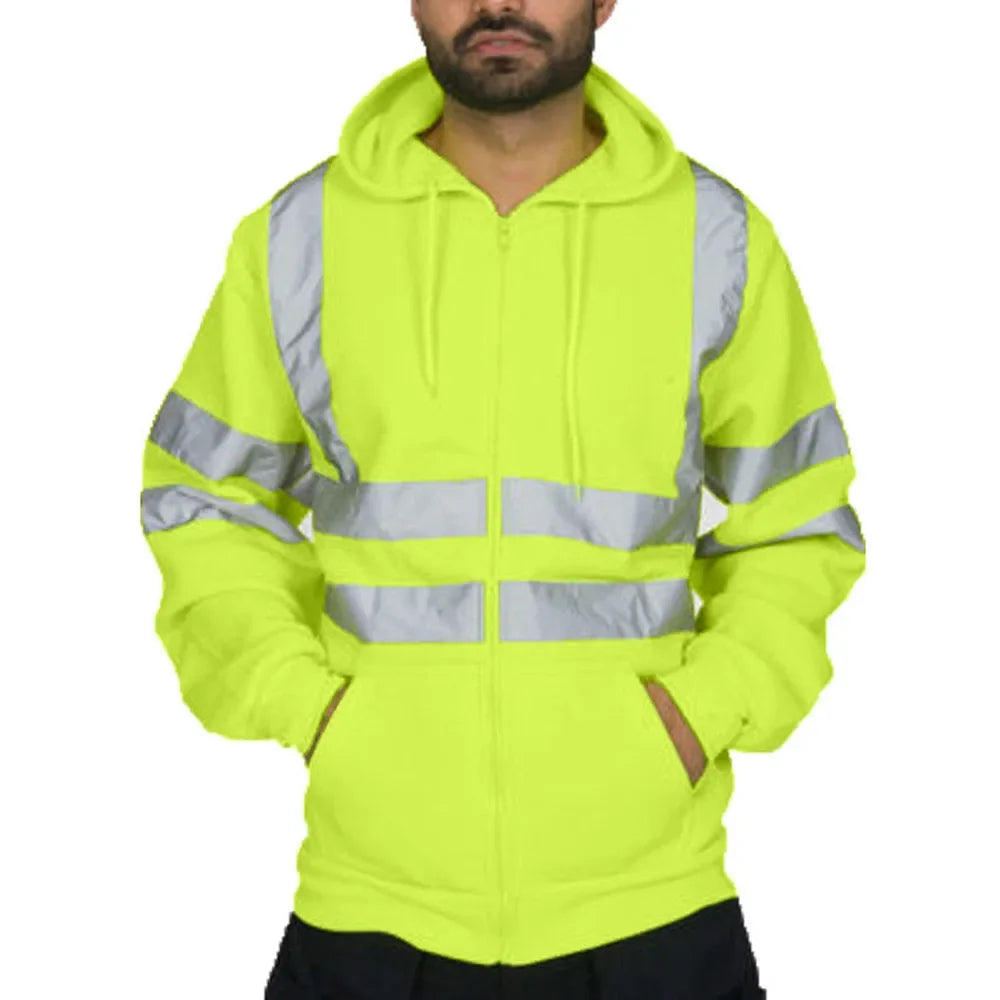 Person wearing a bright yellow safety hoodie with reflective stripes on a white background