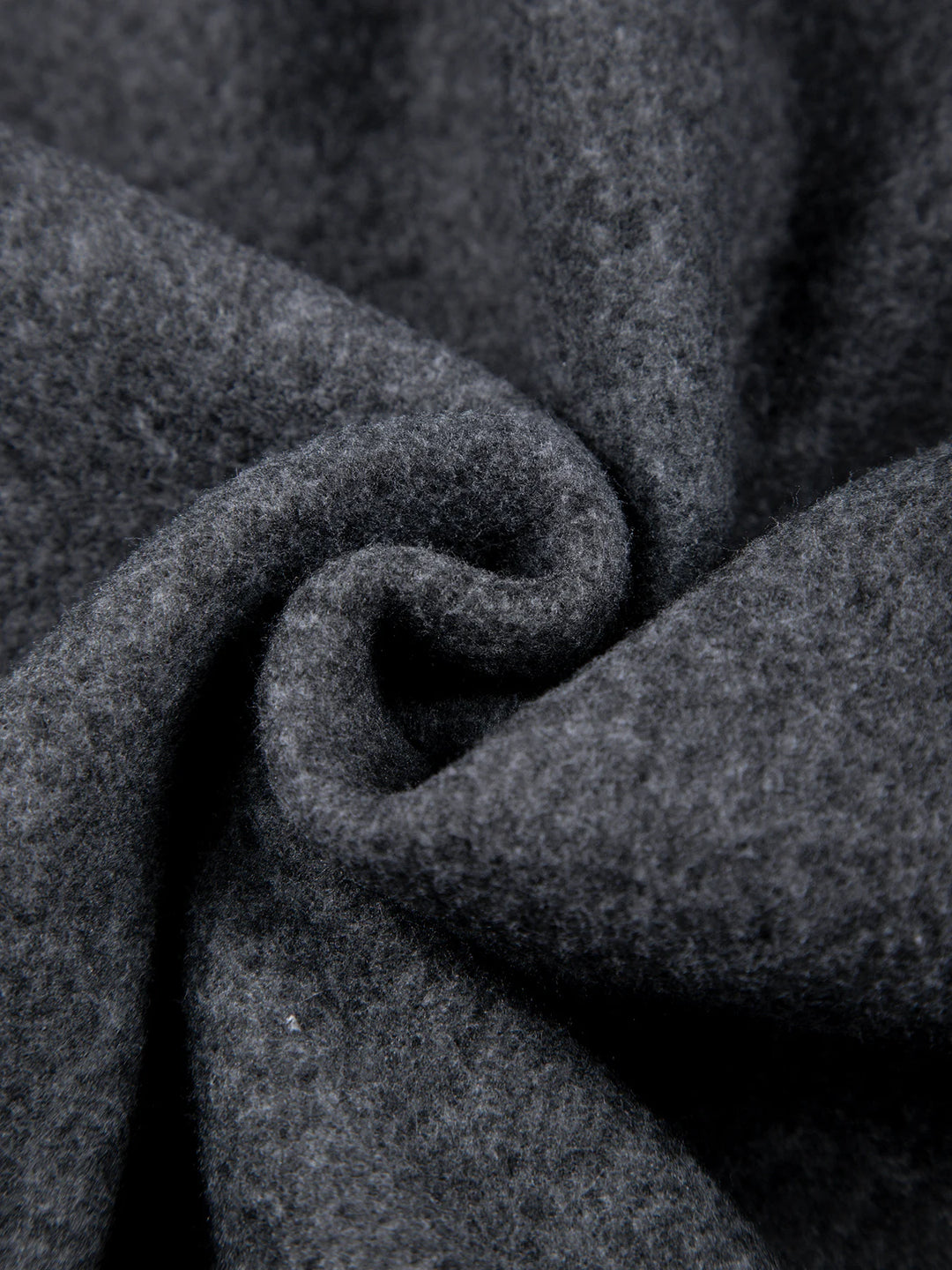 Close-up of dark gray fabric with a textured pattern