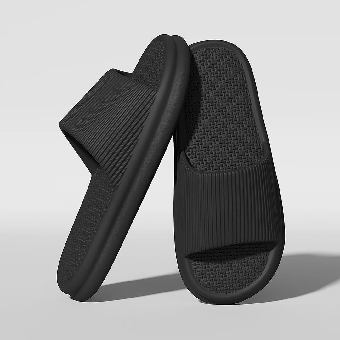 Pair of black slides on a light gray background
