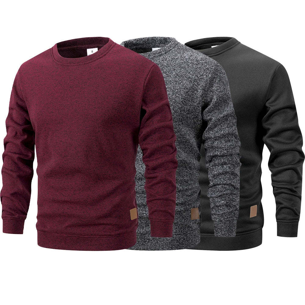 Three maroon, gray, and black sweatshirts displayed side by side on a white background.