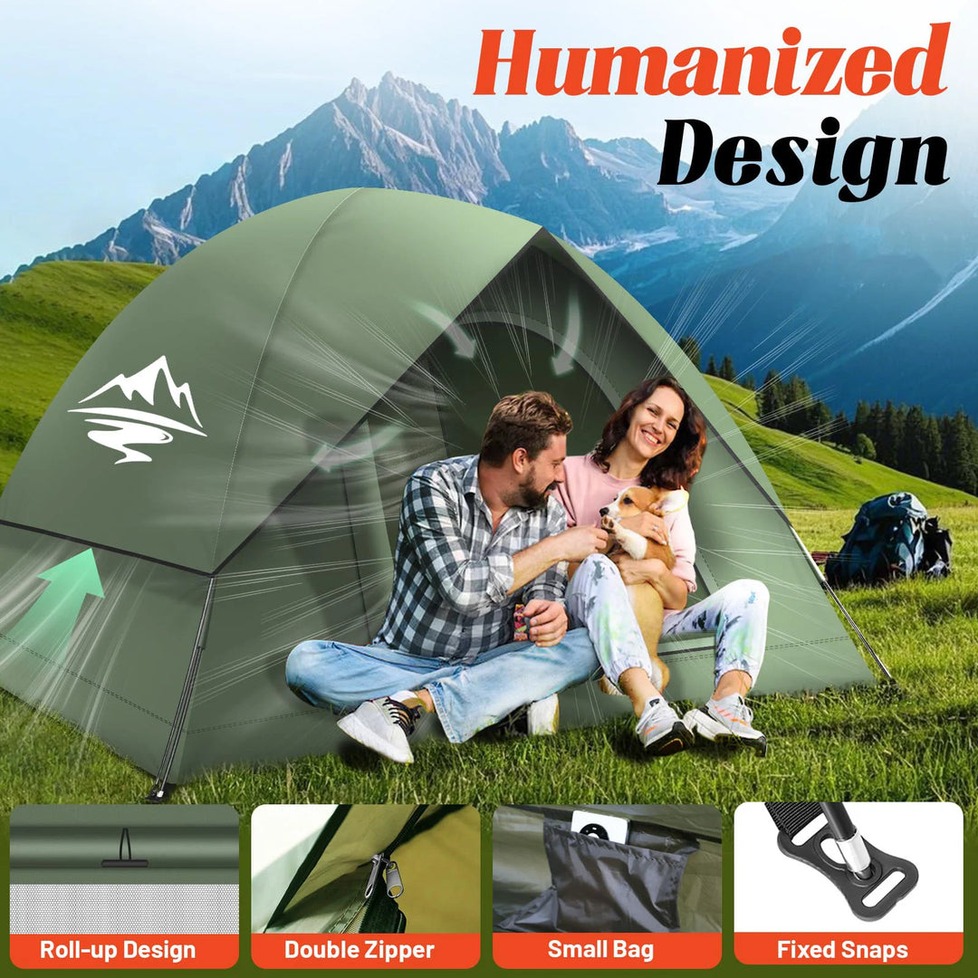 Couple with a dog sitting in front of a green tent with mountains in the background, featuring 'Humanized Design' text.