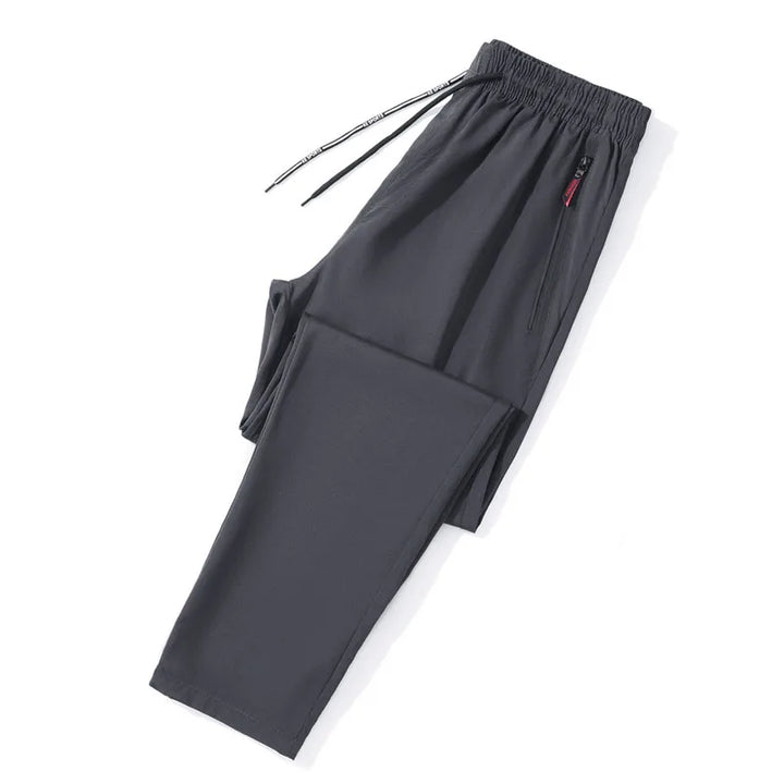 Dark gray pants with drawstring on a white background