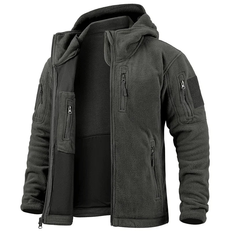 Dark green tactical jacket with multiple pockets and zippers on a white background