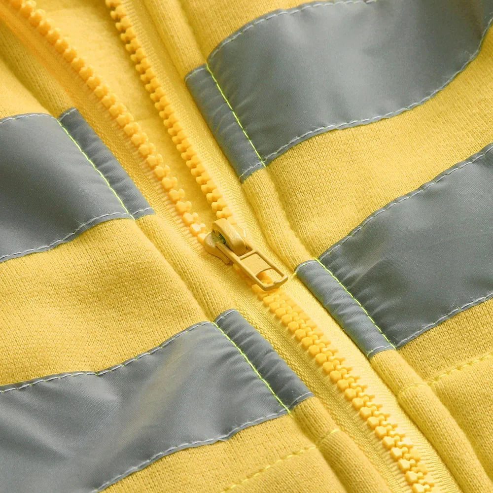 Close-up of a yellow and gray striped jacket with a zipper.