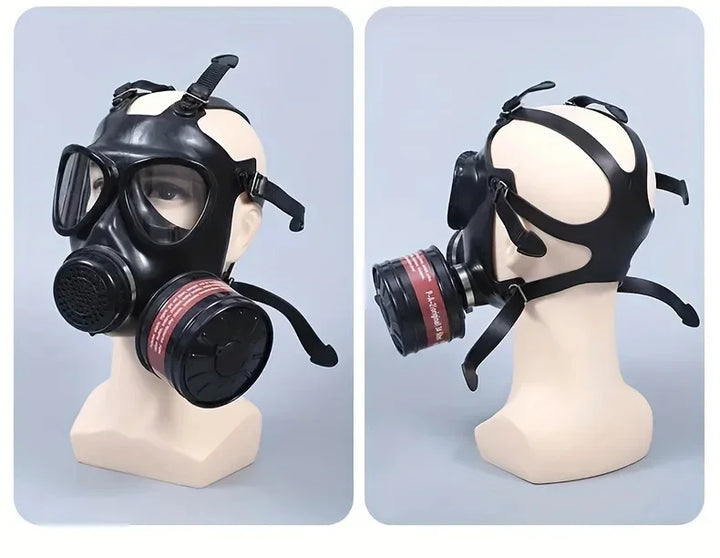 Black gas mask on mannequin heads against a light blue background