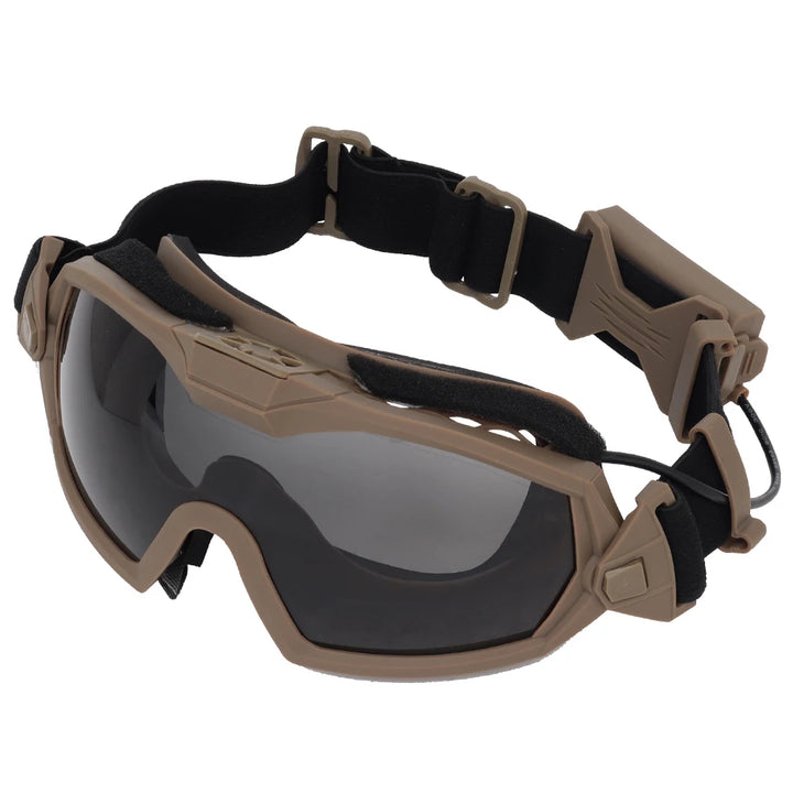 Tan goggles with black straps on a white background