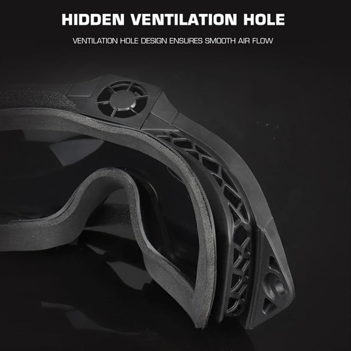 Close-up of a black mechanical component with a hidden ventilation hole on a dark background.