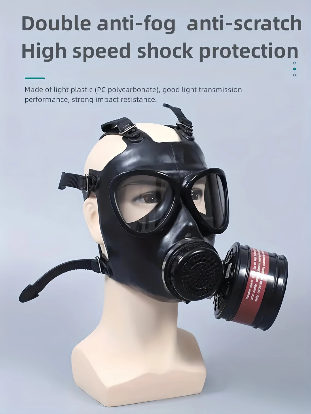 Black gas mask on a mannequin head with text highlighting features on a gray background